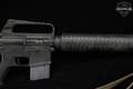 Colt SP1 .223 Rem. Doesn't match – likely an aftermarket refinish/camouflage paint over the original finish in Fair Condition Image 5
